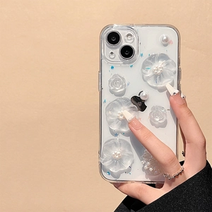 Detail of 3D matte floral and pearl embellishments on a clear protective iPhone case