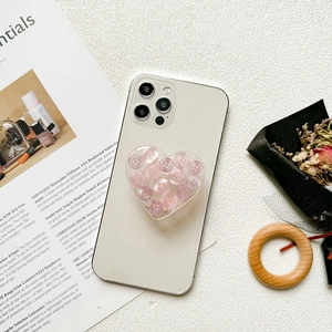 3D heart shaped phone socket with purple buttons on a white smartphone back