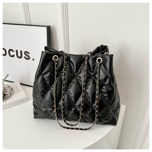 Quilted black bucket tote bag with gold chain straps and stylish rhombus pattern