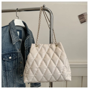 Chic beige quilted bucket bag with chain strap and stylish diamond pattern for women