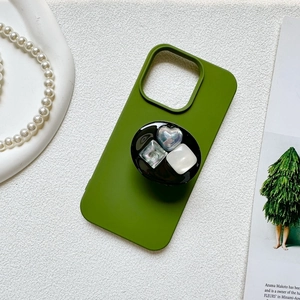 Close-up of green phone grip with heart and square gemstone embellishments
