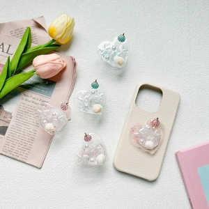 Support téléphone cœur thème océan avec perles et étoiles de mer sur coque