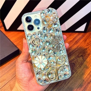 Macro detail of luxury iPhone case with crystals, floral accents and bow decorations