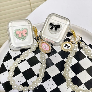 Clear AirPods case with 3D bow heart design and long pearl handle strap accessory