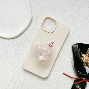 Coque de téléphone crème avec support cœur orné de perles et coquillages marins