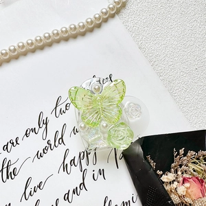 Detail of 3D rose and butterfly phone grip with pearls on a heart-shaped base