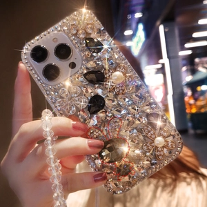 Detail of luxury iPhone case with crystals pearls flowers and transparent beaded strap