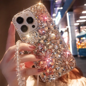Luxury iPhone case featuring handmade rhinestones, metal flowers and a beaded strap
