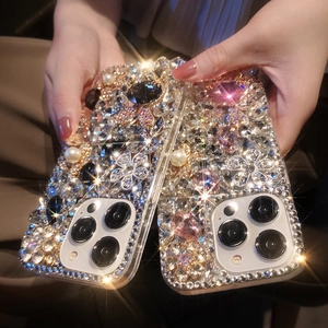 Detail of luxury iPhone case featuring sparkling rhinestones, pearls and floral gemstones
