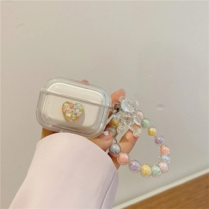 Close-up of clear AirPods Pro case with 3D colorful heart and rainbow beaded hand strap