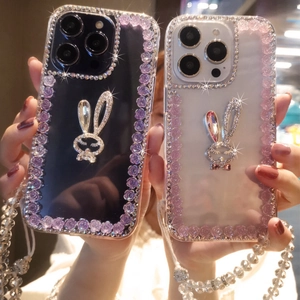Detailed view of luxury iPhone case with rhinestone rabbit, purple roses and beaded strap