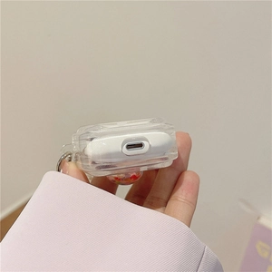 Close-up of clear glitter AirPods case showing precise bottom charging port cutout