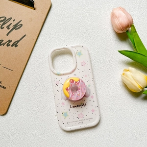 3D donut phone grip on star pattern case with cute pom-pom details and floral decor