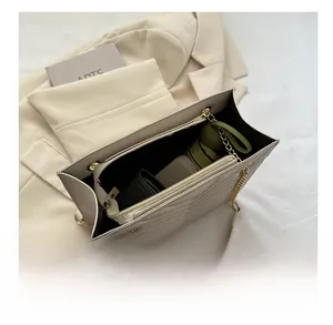 Detail view of large tote bag interior showing the zipper compartment and capacity