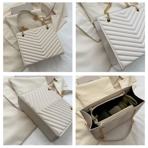 Close-up of ivory quilted tote bag showing chevron stitching and gold chain leather strap