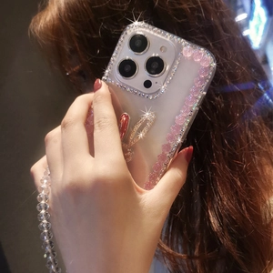 Detail of iPhone case with rhinestone rabbit stand and pink floral bead strap