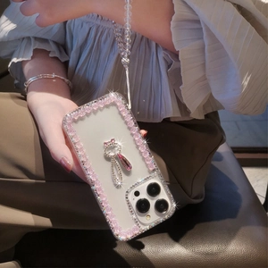 Detail of luxury iPhone case with 3D pink roses, crystal rabbit, and beaded strap