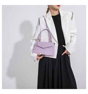 Detail of light purple woven texture PU leather crossbody bag with top handle and flap