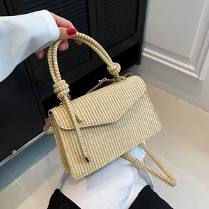 Chic beige woven crossbody handbag with top knot handle and adjustable shoulder strap