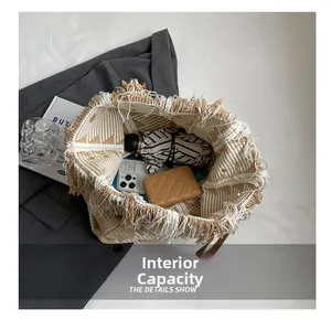 Internal capacity of the knit fringe tote bag showing space for phone and umbrella