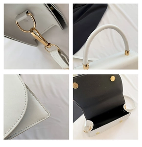 Dettaglio della borsa in pelle PU bianca con finiture dorate e cuciture precise