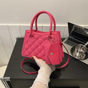 Pink quilted leather crossbody handbag set with matching envelope card pouch