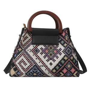 Ethnic style geometric woven handbag with wooden handles and colorful patterns