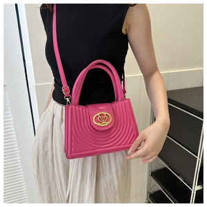 Detailed fuchsia PU leather handbag with arc quilting and heart V-shaped gold metal buckle