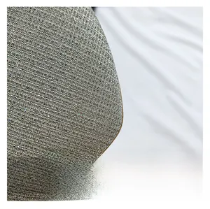 Macro shot of silver sequin fabric texture on a fashion handbag with metallic glitter