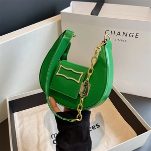 Grass green crescent shoulder bag with golden geometric hardware and chain strap