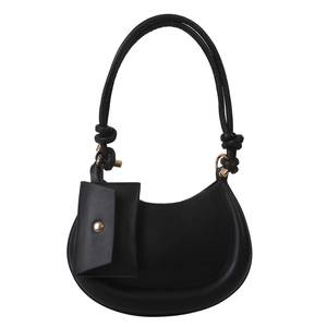 Minimalist black half-moon shoulder bag with knot strap and gold button pouch