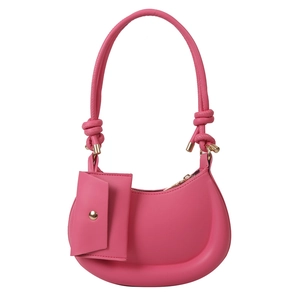 Minimalist bright pink leather crescent hobo bag with knotted handle and small pouch