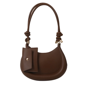 Minimalist dark brown crescent shoulder bag with knotted strap and small pouch