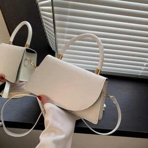 Minimalist white PU leather crossbody bag with top handle and gold hardware detail