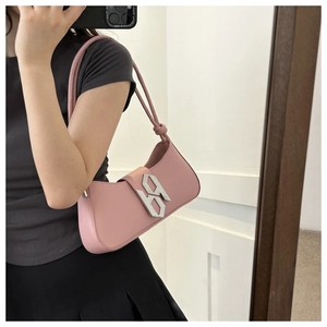 Detailed mirror selfie of a pink hobo bag featuring silver metal buckle and knotted strap