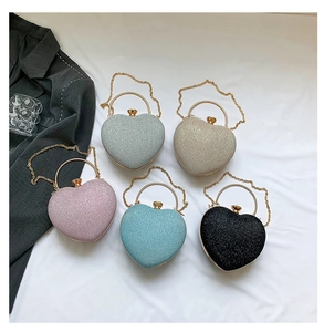Glitter heart-shaped evening clutch bags in multiple colors with metal ring handles