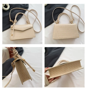 Detailed views of beige minimalist square bag with vertical pleated texture and knotted handle