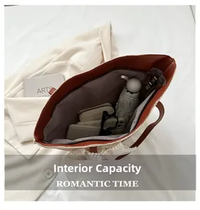 Interior view showing the large capacity of the woven tote bag with leather handles