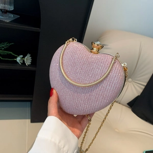 Sac à main cœur rose avec paillettes, chaîne dorée et poignée ronde en métal