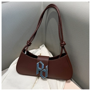 Detail of dark brown leather handbag with silver PD metal logo and knotted thin straps
