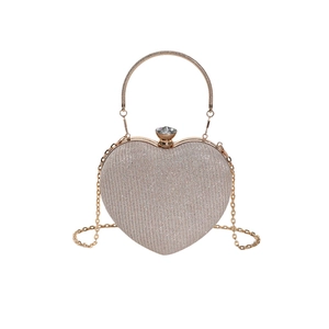 Elegant champagne gold heart-shaped evening bag with sequins, ring handle and jewel clasp