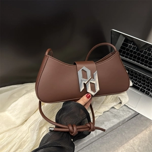 Brown leather crescent underarm bag with silver metal PD buckle and knot shoulder strap