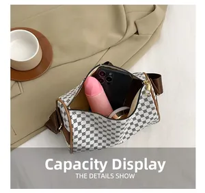 Internal storage view of vintage cylinder bag holding phone, cosmetics and water bottle
