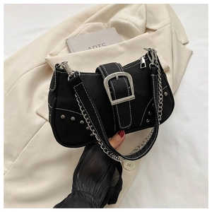 Close-up of black canvas underarm bag with white stitching and silver hardware detail
