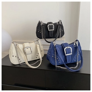 Detailed view of canvas baguette bags with contrast stitching and silver hardware