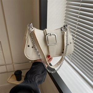 Minimalist off-white canvas underarm bag with vintage silver buckle and chain detail