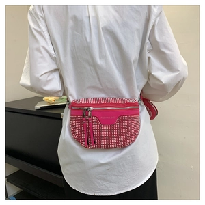 Detail of rose red rhinestone saddle bag with long tassels and mini round coin pouch
