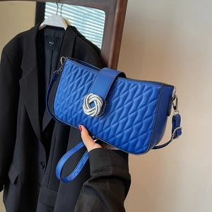 Royal blue quilted leather shoulder bag with silver twist lock and diamond stitch pattern