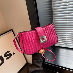Hot pink quilted leather shoulder bag with a silver knot clasp and stylish baguette shape