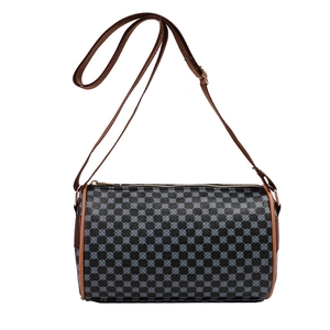 Vintage cylinder crossbody bag with blue geometric pattern and brown shoulder strap